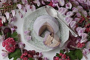 Colorful japanese daifuku mochi sweets with flower decoration