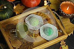 Colorful japanese sweets daifuku or mochi. Sweets close up on the plate with cup of matcha tea