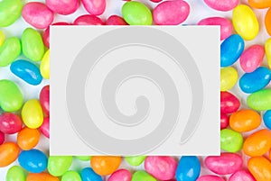 Colorful jelly bean background with white square space for text