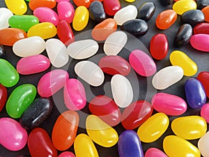 Colorful  jelly beans candy  up close on a black background