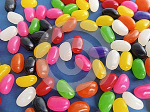 Colorful  jelly beans candy  up close on a blue background
