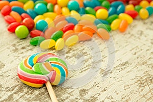 Colorful jelly beans and a lollypop