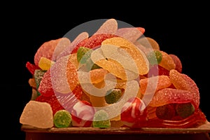 Colorful jelly candies on a black background