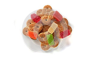 Colorful jelly candies and cookies isolated