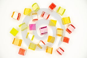 Colorful jelly candy mix white granulated sugar on white background