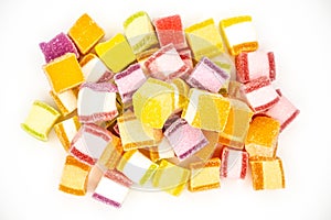 Colorful jelly candy mix white granulated sugar on white background
