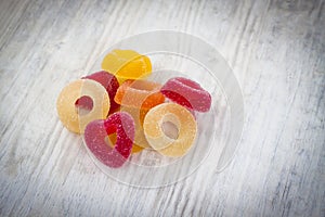 Colorful Jelly Candy on white wooden background