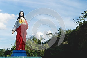 Colorful Jesus statue on the graveyard of Valladolid, Yucatan, Mexico