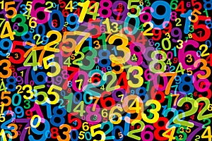 Jumbled colorful numbers, over black photo