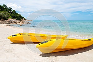 Colorful Kayak boat on tropical beach seaside with blue sky and cloud. Sport, recreation for tourist during holiday vacation