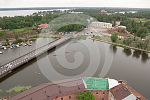 Colorful kayaks are floating on the river. Ship, boats and bridge in Vyborg, Russia