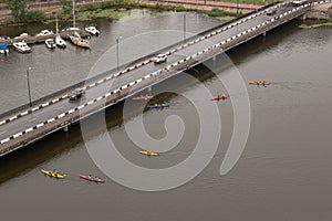 Colorful kayaks are floating on the river. Ship, boats and bridge in Vyborg, Russia