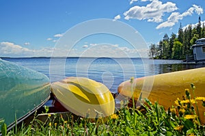 Colorful Kayaks on Lake Shore at Summer