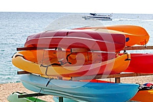 Colorful kayaks for rent on the beach photo