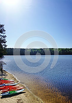 Colorful kayaks on the shore of Lake Johnson, a popular city park in Raleigh NC