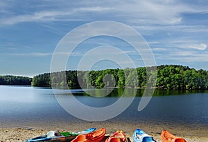 Colorful kayaks on the shore of Lake Johnson, a popular city park in Raleigh North Carolina