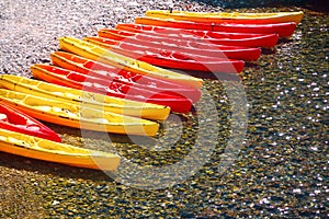 colorful kayaks on the shore