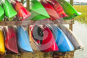 Colorful kayaks tied up on Hilton Head Island dock on water