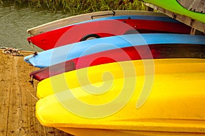 Colorful kayaks tied up on Hilton Head Island dock on water