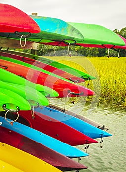 Colorful kayaks tied up on Hilton Head Island dock on water