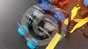 Colorful kettlebells on the floor in a gym