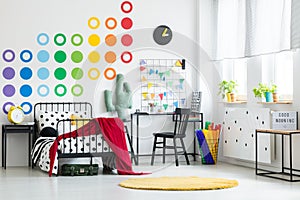 Colorful kid`s bedroom with clock