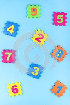 Colorful kids numbers toys on blue background