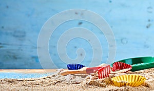 Colorful kids toys on a sandy beach