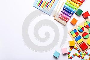 Colorful kids toys on white background. Top view, flat lay