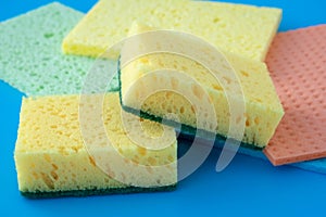 Colorful kitchen dry sponges for cleaning, housekeeping. Kitchen dishcloth close-up, clean up concept, housework