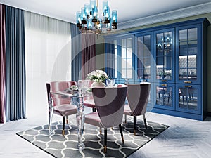 A colorful kitchen in a neoclassic style with blue furniture and green walls, a dining table with soft pink chairs