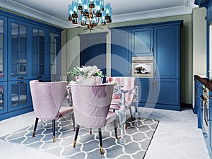 A colorful kitchen in a neoclassic style with blue furniture and green walls, a dining table with soft pink chairs