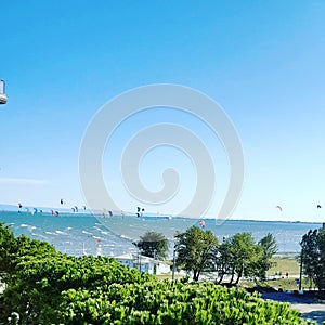 Colorful kitesurfers photo