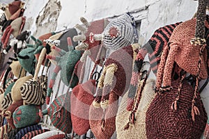 Colorful knit hats hanged on wall