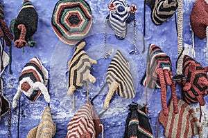 Colorful knit hats hanged on wall