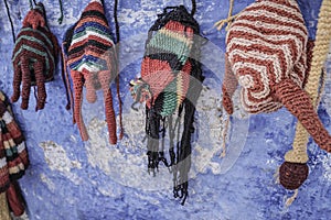 Colorful knit hats hanged on wall