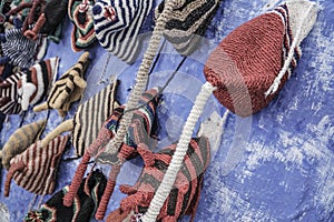 Colorful knit hats hanged on wall