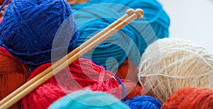 Colorful knitting thread balls on a table