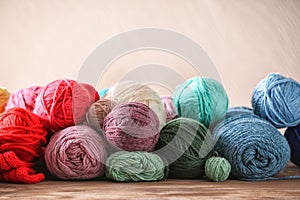 Colorful knitting yarn on wooden table