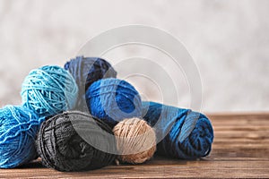 Colorful knitting yarn on wooden table