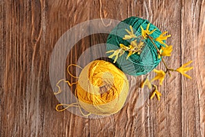 Colorful knitting yarn on wooden table