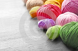 Colorful knitting yarn on wooden table