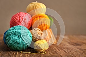 Colorful knitting yarn on wooden table