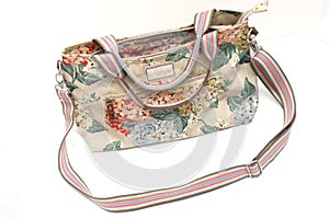 A colorful ladies sling bag with floral printings