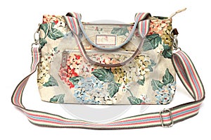 A colorful ladies sling bag with floral printings