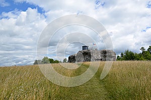 Colorful landscape with field and sky and old military fortress