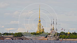Colorful landscape of the green embankment of St. Petersburg near the Trinity Bridge with the Peter and Paul Fortress