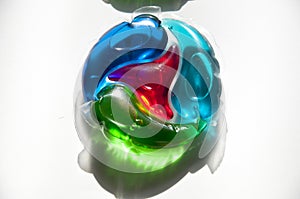 Colorful laundry detergent gel pods. fabric softener in washing capsule