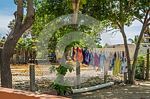 Colorful laundry drying off Playa Larga, Zihuatanejo, Mexico photo