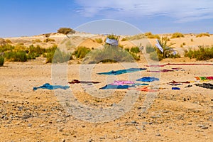 Colorful laundry drying in the sun on sand. Algeria, Afrika
